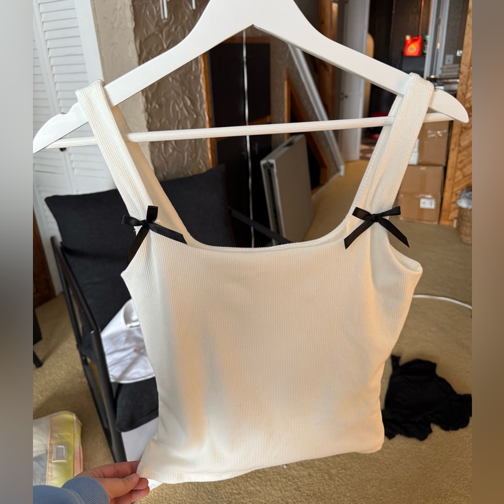 Elegant Cream Tank Top with Black Bow Accents